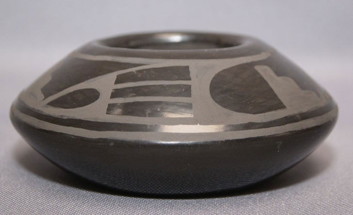 SAN ILDEFONSO POTTERY JAR: 1970's Matt on black design signed Alice Martinez, 2.25" X 5" Shipping charge are for the United States. The shipping on this lot is $10.00. Outside the United States there will be additional shipping