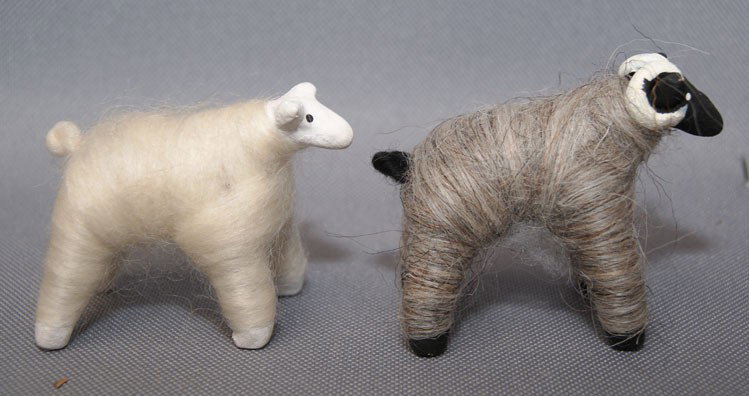 TWO PIECES OF NAVAJO FOLK ART: 1980s-90s sheep made from clay and wool, 2.25" X 2.75" X 1.75" Shipping charge are for the United States. The shipping on this lot is $10.00. Outside the United States there will be additional shippin