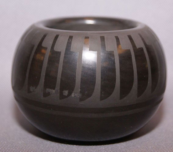 SAN ILDEFONSO BLUE CORN POTTERY BOWL: 1970's matt on black design with minor rubs signed Blue Corn, 2.5" X 3.5" Shipping charge are for the United States. The shipping on this lot is $10.00. Outside the United States there will be additio