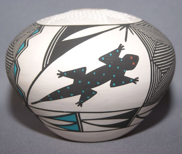 ACOMA CERAMIC SEED JAR: 1980s polychrome and fine line design signed J. Garcia, 4" x 5.5" Shipping charge on this item is $10.00. Unless noted all items have some amount of acceptable wear, scratches, nicks, missing stitches