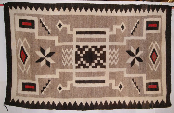 NAVAJO TEXTILE: 1940s storm pattern has minor stains, 66" x 41" Shipping charge are for the United States. The shipping on this lot is $15.00. Outside the United States there will be additional shipping fees. Unless 