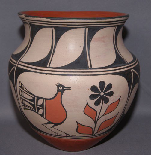 SANTO DOMINGO POTTERY JAR: 1980s geometric and bird design has rubbing and scratches signed Robert Tenorio, 10" x 10" Shipping charge are for the United States. The shipping on this lot is $20.00. Outside the United States ther
