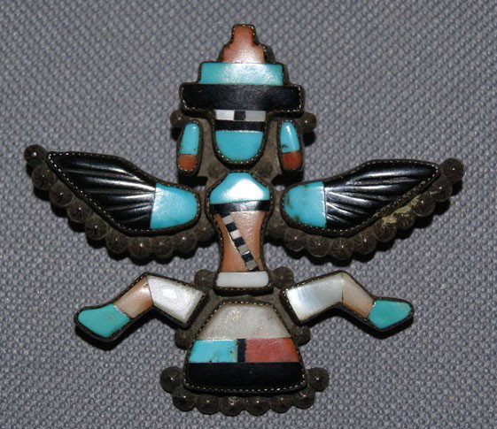 ZUNI KNIFE WING PIN: 1940s-50s sterling silver and stone to stone inlaid carved wings artist Leo Poblano, 2" x 2.25" Shipping charge are for the United States. The shipping on this lot is $10.00. Outside the United States