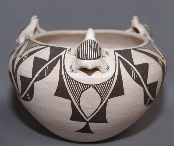 ACOMA POTTERY JAR: 1970s black on white with 3 dimensional turtles minor pitting signed Jess Garcia 5.75" x 7.5" Shipping charge are for the United States. The shipping on this lot is $10.00. Outside the United States t