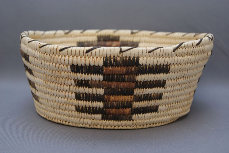 PAPAGO BASKET: 1970s 80s hand-woven polychrome design with minor stitch loss 4.25" x 9.5" Shipping charge are for the United States. The shipping on this lot is $10.00. Outside the United States there will be additi