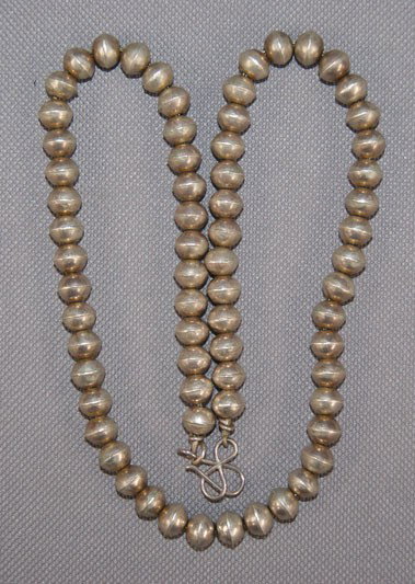 PUEBLO NECKLACE: 1970s 80s sterling silver single strand of beads 19 inches long Shipping charge are for the United States. The shipping on this lot is $10.00. Outside the United States there will be additional shippi