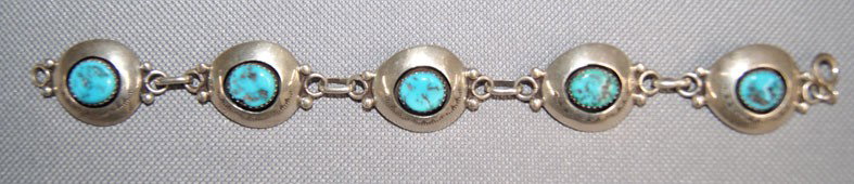 NAVAJO BRACELET: 1970s 80s sterling silver and turquoise hand stamped design link style .75" x 7" Shipping charge are for the United States. The shipping on this lot is $10.00. Outside the United States there will be 