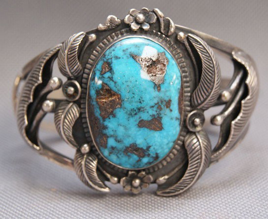 NAVAJO BRACELET: 1960s 70s sterling silver and turquoise hand stamp design signed with logo 2" x 5.25" x 1.25 opening Shipping charge are for the United States. The shipping on this lot is $10.00. Outside the United S