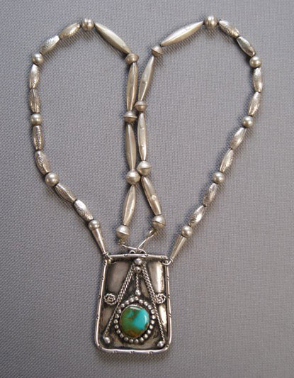 NAVAJO NECKLACE: 1970s 80s sterling silver and turquoise pendant made from bolo 2" x 1.5" 22 inches long Shipping charge are for the United States. The shipping on this lot is $10.00. Outside the United States there w
