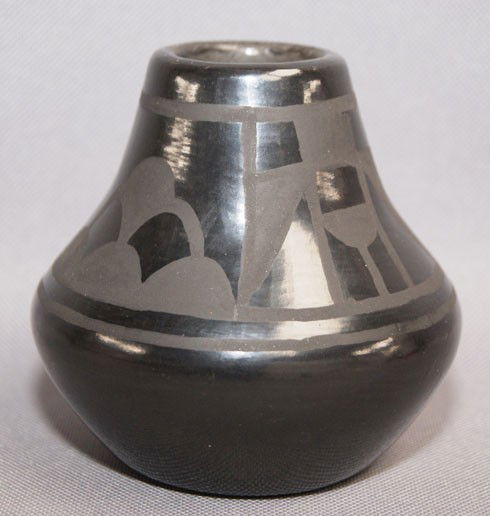 SAN ILDEFONSO POTTERY JAR: 1980s 90s matte on black design has surface scratches signed Lucy Martinez 3.5" x 3.5" Shipping charge are for the United States. The shipping on this lot is $10.00. Outside the United States there wi