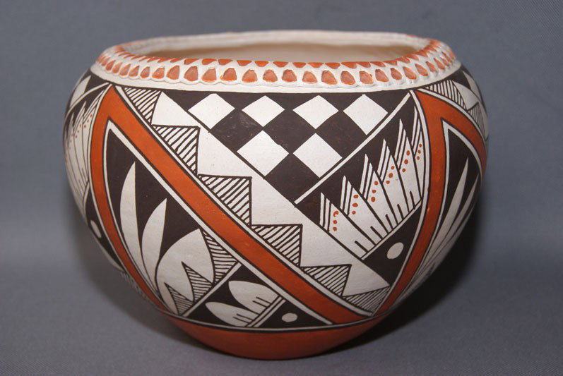 ACOMA POTTERY JAR: 1970s 80s Polychrome design with incised rim signed Meno 6.25" x 8" Shipping charge are for the United States. The shipping on this lot is $10.00. Outside the United States there will be additional sh
