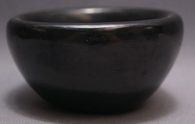 SAN ILDEFONSO POTTERY BOWL: 1980's black ware minor rubs signed Alice Martinez 2" x 3.5" Shipping charge are for the United States. The shipping on this lot is $10.00. Outside the United States there will be additional shipping