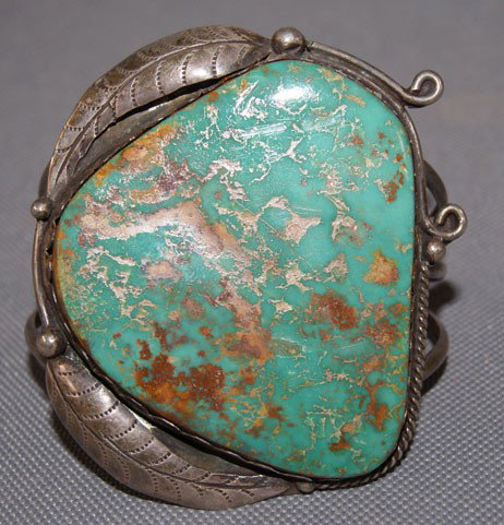 NAVAJO BRACELET: 1960's 70's sterling silver and large turquoise stone made by Bobby Thompson, 3" x 5" 1.25 opening Shipping charge are for the United States. The shipping on this lot is $10.00. Outside the United Sta