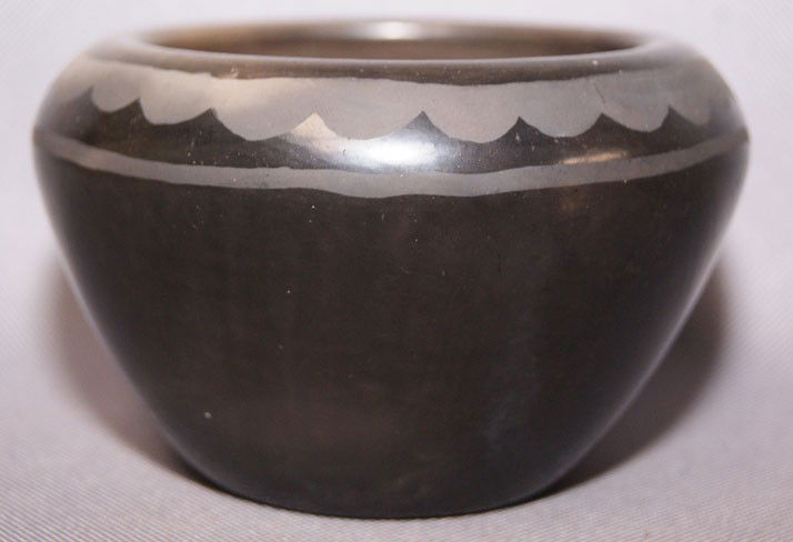SAN ILDEFONSO POTTERY BOWL: 1980's 90's matte on black has minor surface rubbing signed Alicia Martinez, 3" x 4.75" Shipping charge are for the United States. The shipping on this lot is $10.00. Outside the United States there w