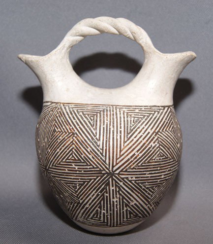 ACOMA POTTERY WEDDING VASE: 1960's 70's fine line design has lots of pitting, signed M.Z. Chino has crack on lip, 6" x 5" Shipping charge are for the United States. The shipping on this lot is $10.00. Outside the United States t