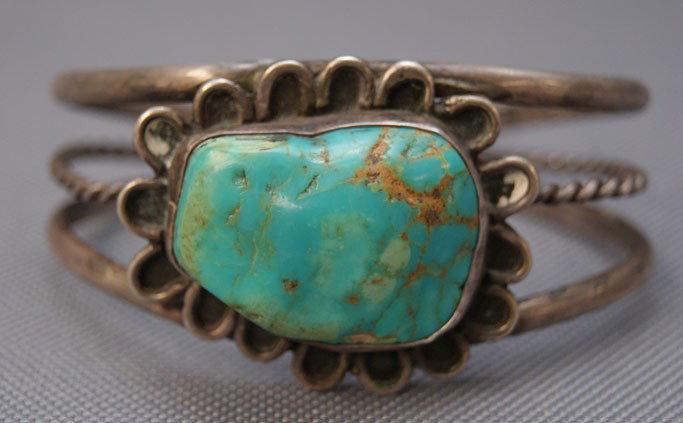 NAVAJO BRACELET: 1960s 70s sterling silver with single turquoise stone 6" x 1.5" x 1" Shipping charge are for the United States. The shipping on this lot is $10.00. Outside the United States there will be additional s