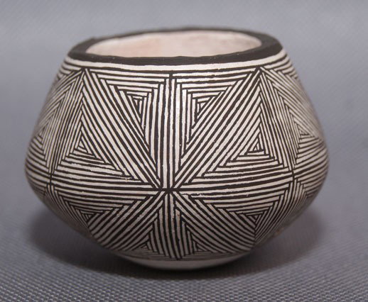ACOMA POTTERY JAR: 1980s miniature fine line design has minor pitting, signed Emma Lewis 1.5" x 2.25" Shipping charge are for the United States. The shipping on this lot is $10.00. Outside the United States there will b