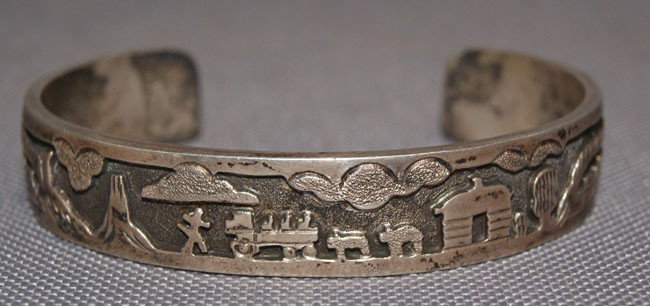 NAVAJO BRACELET: 1980s sterling silver shadow box design signed Henry, 5.25" x .5" x 1.25" Shipping charge are for the United States. The shipping on this lot is $10.00. Outside the United States there will be additio