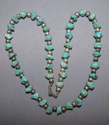Pueblo necklace: 1960s 70s single strand turquoise nugget and silver beads, 22" long Shipping charge are for the United States. The shipping on this lot is $10.00. Outside the United States there will be additional sh