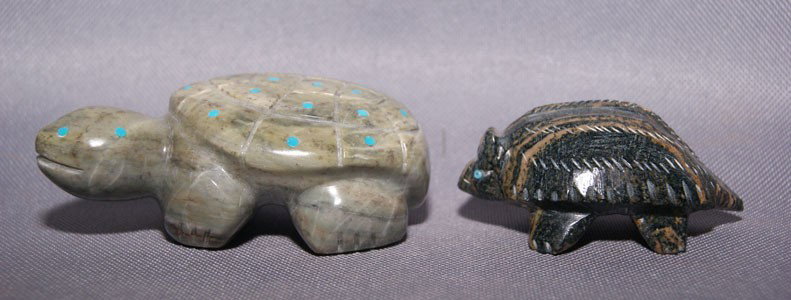 2 Zuni fetishes: 1970s 80s turtle inlaid with turquoise, otter has inlaid bead eyes, largest 3.5" x 1.5" Shipping charge are for the United States. The shipping on this lot is $10.00. Outside the United States there w