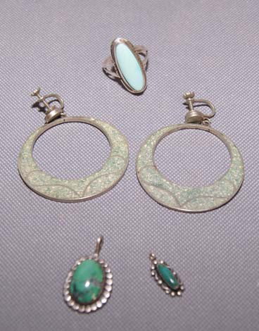 NAVAJO AND MEXICAN SILVER JEWELRY: 1960s to 70s one pair Mexican loop earrings, Navajo turquoise ring, two small turquoise pendants, various sizes Shipping charge are for the United States. The shipping on this lot is $10.00. Outside t