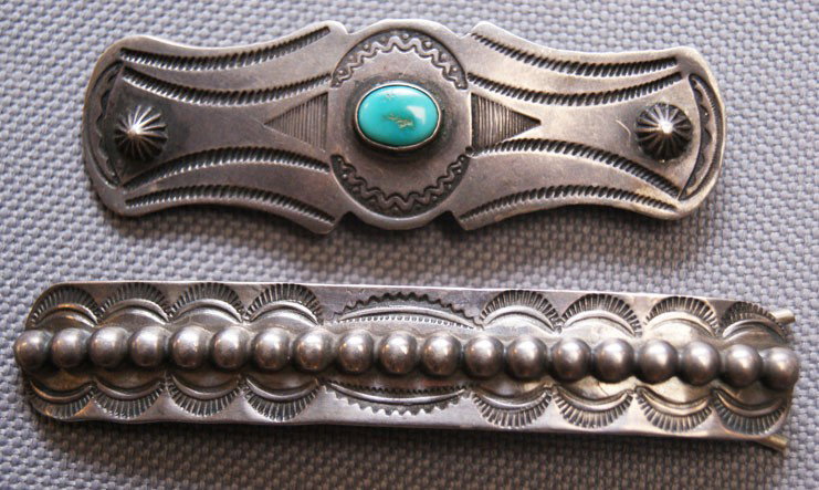TWO NAVAJO HAIR BARRETTES: 1960s 70s sterling silver hand stamped design, one has single turquoise stone 2.5" x .75", all silver one .5" x 3" Shipping charge are for the United States. The shipping on this lot is $10.00. Outsid