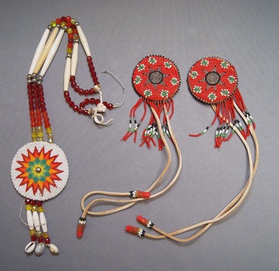 THREE PLAINS BEADED ITEMS: 1970s 80s two hair ties with minor bead loss, 3" in diameter. Necklace has beaded rows one broken strand and missing beads, 3" in diameter & 24" long Shipping charge are for the United States. The shi