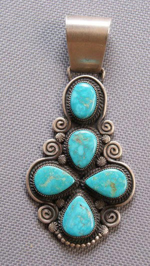NAVAJO PENDANT: 1970s 80s sterling silver and turquoise signed with logo and c.mtz, 3" x 1.5" Shipping charge are for the United States. The shipping on this lot is $10.00. Outside the United States there will be add