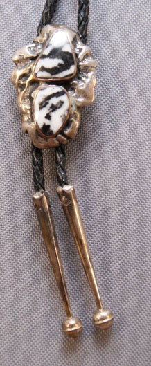 NAVAJO BOLO: 1970s 80s cast sterling Silver and two stones 2" x 1.25" Shipping charge are for the United States. The shipping on this lot is $10.00. Outside the United States there will be additional shipping fees