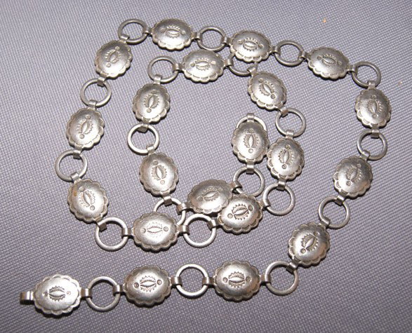 NAVAJO HAT BAND: 1980s 90s nickel silver hand stamped design links style , 20 conchos 1" x .5, Buckle 30" long Shipping charge are for the United States. The shipping on this lot is $10.00. Outside the United States t