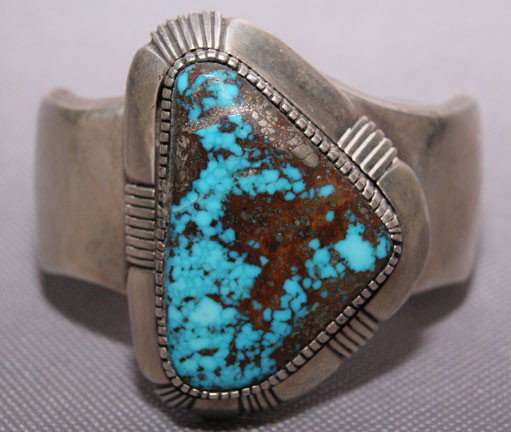 NAVAJO BRACELET: 1970s 80s heavy sterling Silver single turquoise stone, 5.5" x 2" x 1" Shipping charge are for the United States. The shipping on this lot is $10.00. Outside the United States there will be additional