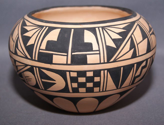 SAN FELIPE POTTERY JAR: 2007 black on orange with minor pitting and rubbing signed Joseph/Nona Llatoma, 4" x 6" Shipping charge are for the United States. The shipping on this lot is $10.00. Outside the United States there w