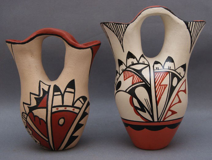 two Jemez pottery wedding vases: 1980s 90s large one signed Mutap 5.5" x 4", small one signed M. Chinana 4.5" x 3.5" Shipping charge are for the United States. The shipping on this lot is $10.00. Outside the United States there will 