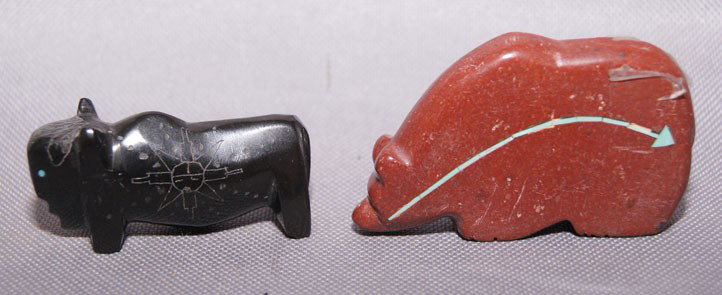 TWO ZUNI FETISHES: 1990s pipestone bear with turquoise heart-line, jet Buffalo with scgrafito design, largest 1.5" x 2.5" Shipping charge are for the United States. The shipping on this lot is $10.00. Outside the United