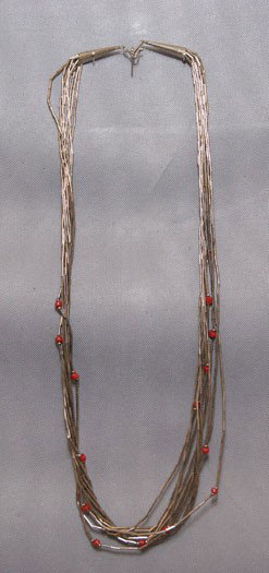 NAVAJO NECKLACE: 1970s 80s sterling silver with 10 strands of liquid silver and coral beads, 28.5" long Shipping charge are for the United States. The shipping on this lot is $10.00. Outside the United States there wi
