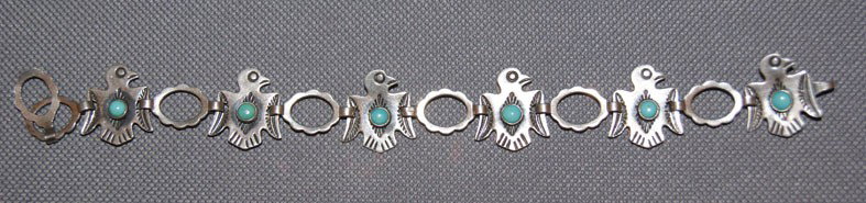 NAVAJO BRACELET: 1960s 70s hand stamped link style sterling silver and turquoise with makers mark, 7.5" x .75" Shipping charge are for the United States. The shipping on this lot is $10.00. Outside the United States t