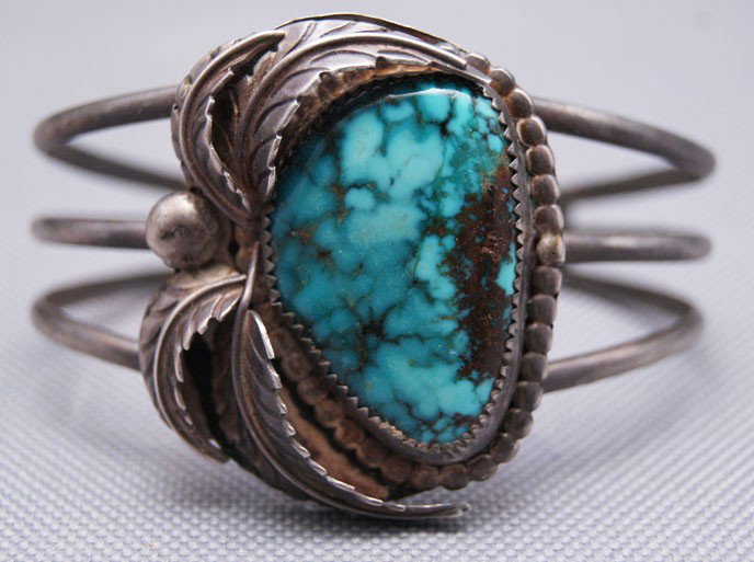 NAVAJO BRACELET: 1970s 80s sterling silver with a single turquoise stone, 5.5" x 1.75" x 1" Shipping charge are for the United States. The shipping on this lot is $10.00. Outside the United States there will be additi