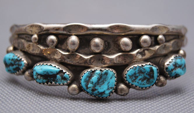 NAVAJO BRACELET: 1970s 80s sterling silver with five turquoise stones, 5.5" x .75"x1" Shipping charge are for the United States. The shipping on this lot is $10.00. Outside the United States there will be additional s
