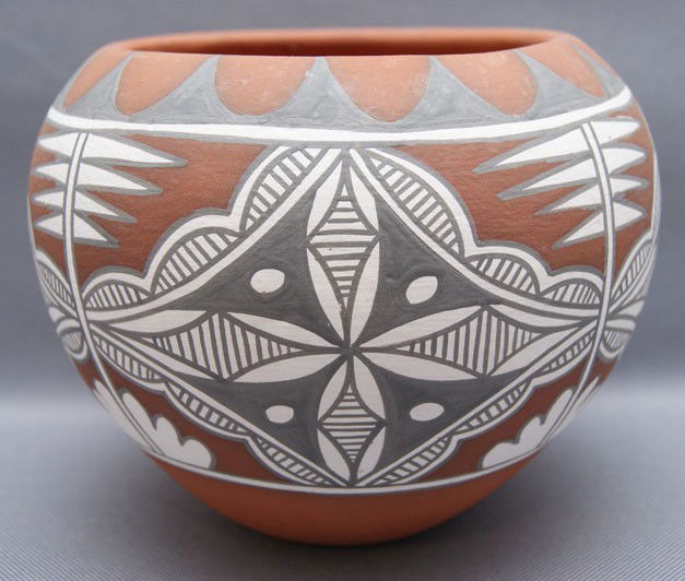 JEMEZ POTTERY BOWL: 1980s-90s hand made and painted black and white on red signed Mary Small, 5.25"x6" The shipping on this lot is $10.00.