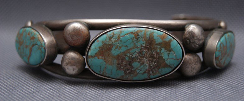 NAVAJO BRACELET: 1970s 80s sterling silver and turquoise, 5.25" x .75" x 1.25" The shipping on this lot is $10.00.