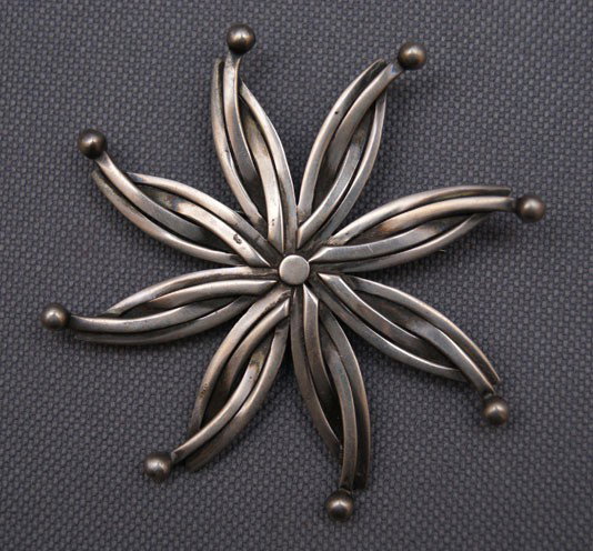 MEXICANS PIN PENDANT: 1970s 80s sterling silver signed Reven, 2.75" diameter The shipping on this lot is $10.00.