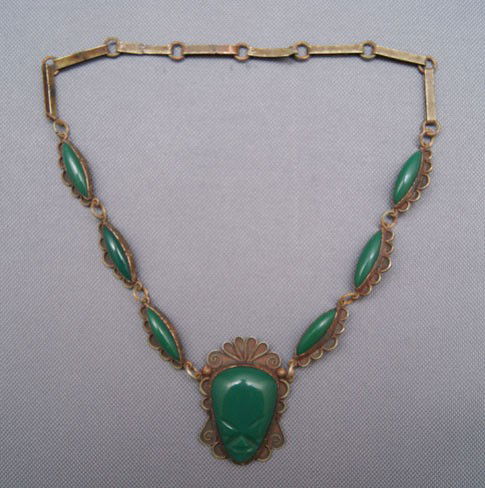 MEXICAN SILVER NECKLACE: 1950 silver with carved jade face, 18.5" long Shipping charge are for the United States. The shipping on this lot is $10.00. Outside the United States there will be additional shipping fees.