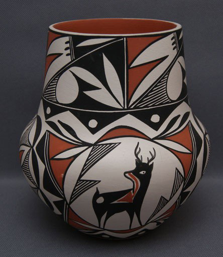 ACOMA POTTERY JAR: 1980s polychrome design with heart line deer by Louise Amos, 6" x 5.5" Shipping charge are for the United States. The shipping on this lot is $10.00. Outside the United States there will be additional