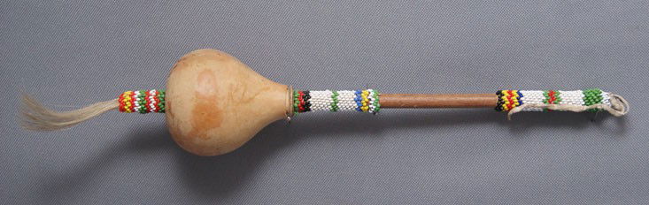 PLAINS PEYOTE RATTLES: 1950s has damage to beadwork on handle, 12" x 2.5" Shipping charge are for the United States. The shipping on this lot is $10.00. Outside the United States there will be additional shipping fees.