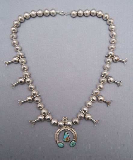 NAVAJO SILVER SQUASH: 1970s 80s sterling silver and turquoise, 26" long Shipping charge are for the United States. The shipping on this lot is $10.00. Outside the United States there will be additional shipping fees.