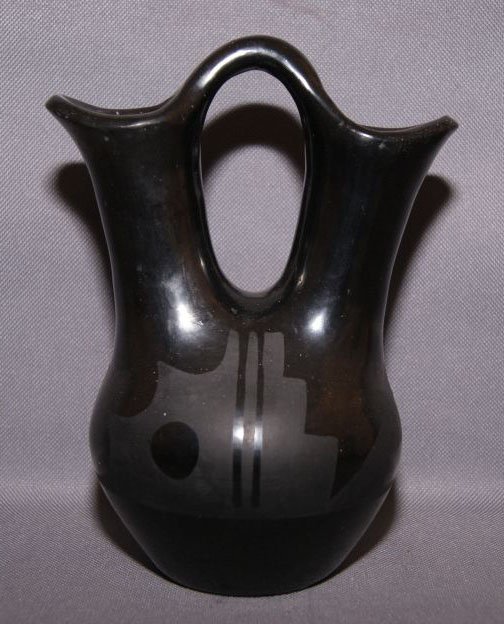 SAN ILDEFONSO WEDDING VASE: 1960s matte on black design by Tonita and Juan, 7" x 5" Shipping charge are for the United States. The shipping on this lot is $10.00. Outside the United States there will be additional shipping fees.