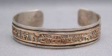 HOPI BRACELET: 1980s 90s sterling silver and 12K gold filled signed J, 5.75" x .5" x 1" Shipping charge are for the United States. The shipping on this lot is $10.00. Outside the United States there will be addition
