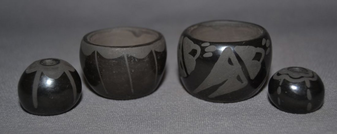 FOUR SANTA CLARA POTS: 1980s 90s matt on black design largest signed Rencie 1"x1.5" medium .8"x1.5" signed Rencie smallest .5"x.75" signed Mary Shipping charge are for the United States. The shipping on this lot is $10.00. 