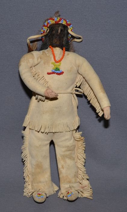 PLAINS INDIAN DOLL: 1950s 60s partially beaded on leather apple face doll 10.5" tall Shipping charge are for the United States. The shipping on this lot is $10.00. Outside the United States there will be additional shipp