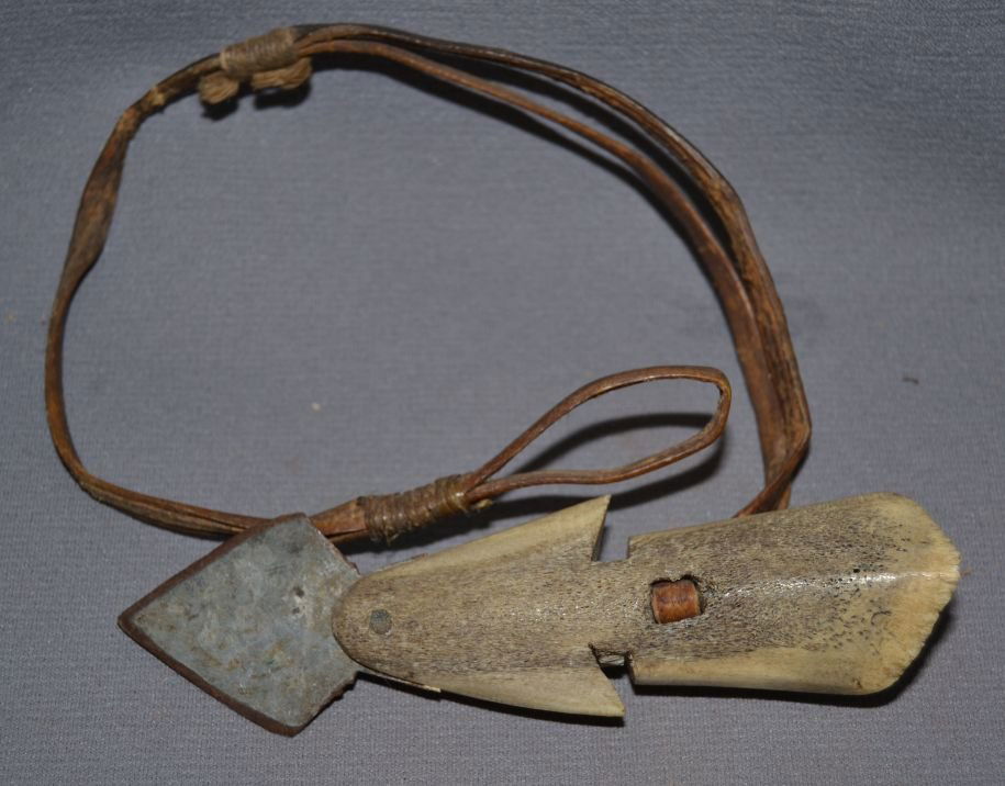 ESKIMO HARPOON HEAD: 1890s 1910 made from bone with metal blade leather strap 6"x1.5" Shipping charge are for the United States. The shipping on this lot is $15.00. Outside the United States there will be additional shipp